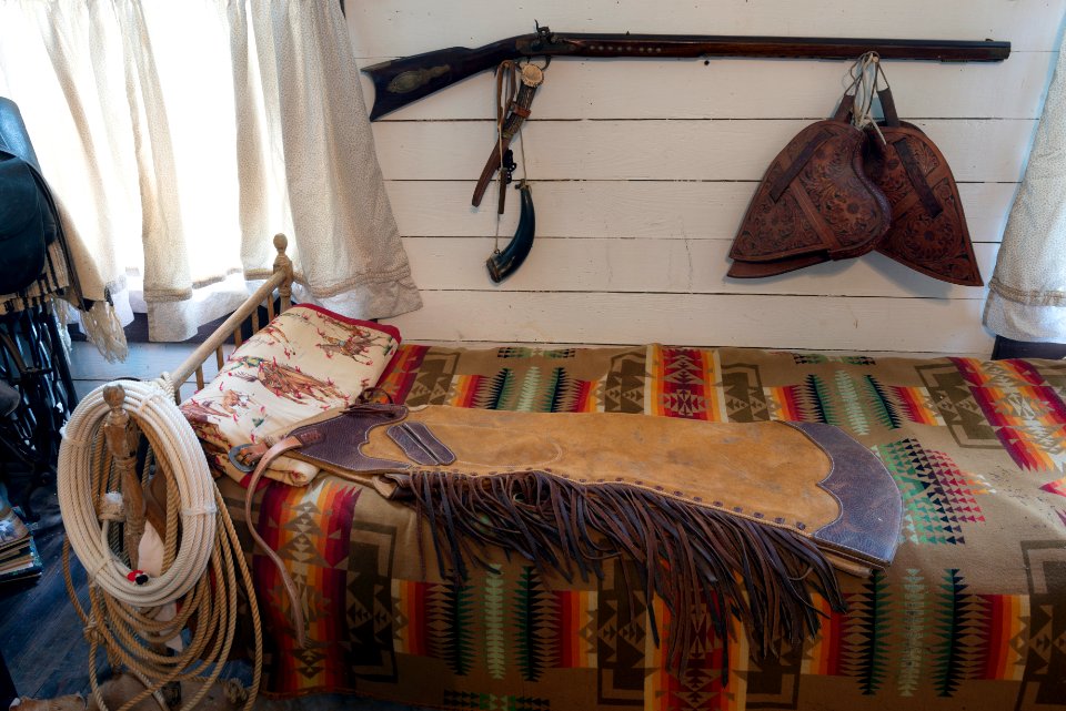 Some of the genuine Old West possessions displayed inside a bunkhouse — a small railroad office moved to the location and converted for ranch use — on a ranch owned by Annie Young Shelton and Ferol Shelton near Clarendon in the Texas Panhandle. Original image from Carol M. Highsmith’s America, Library of Congress collection.