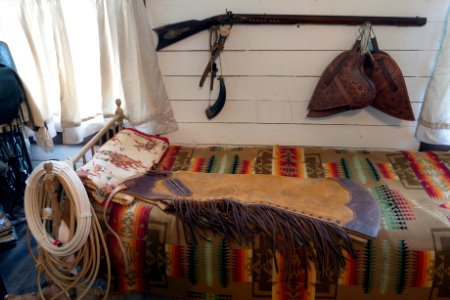 Some of the genuine Old West possessions displayed inside a bunkhouse — a small railroad office moved to the location and converted for ranch use — on a ranch owned by Annie Young Shelton and Ferol Shelton near Clarendon in the Texas Panhandle. Original image from Carol M. Highsmith’s America, Library of Congress collection.