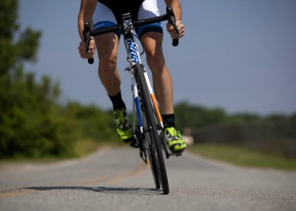 Person Riding Road Bike On The Road photo