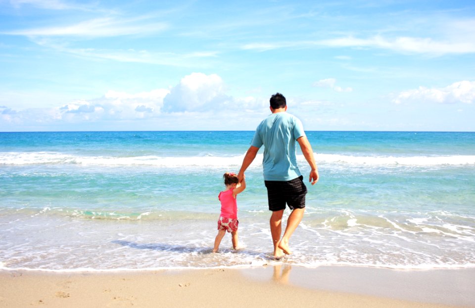 Man And Daughter At Beach
