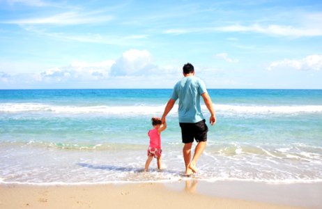 Man And Daughter At Beach photo