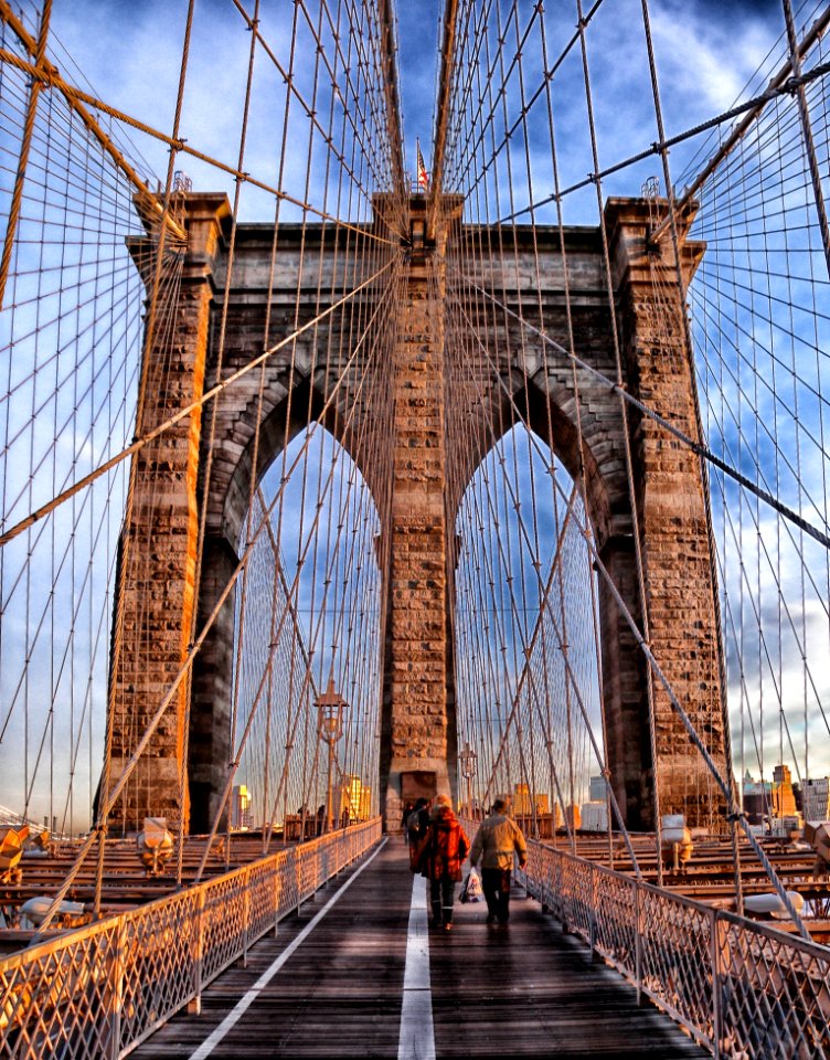 Two Person Walking On Bridge During Daytime photo