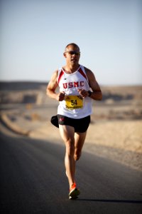 Man In White Jersey While Running photo