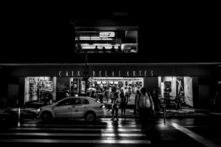 Car Parked On The Street In Grayscale