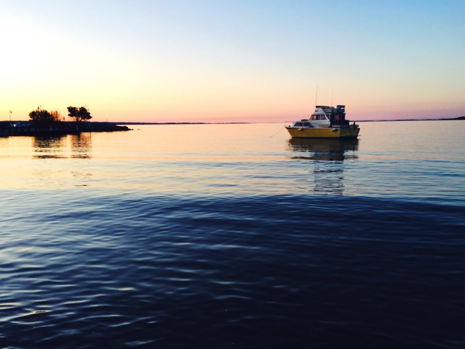 Boat At Sea At Dusk