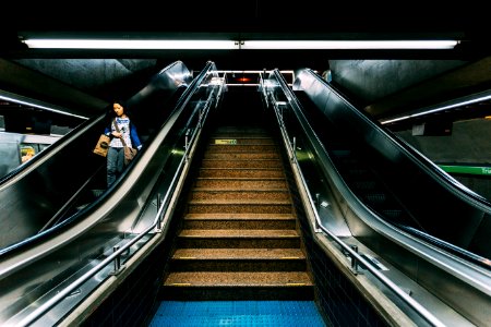 Woman On Escalator In Subway