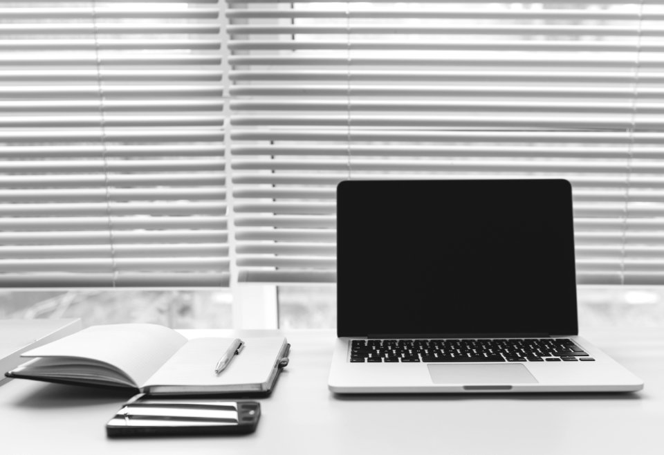 Laptop And Notebooks On Desk photo