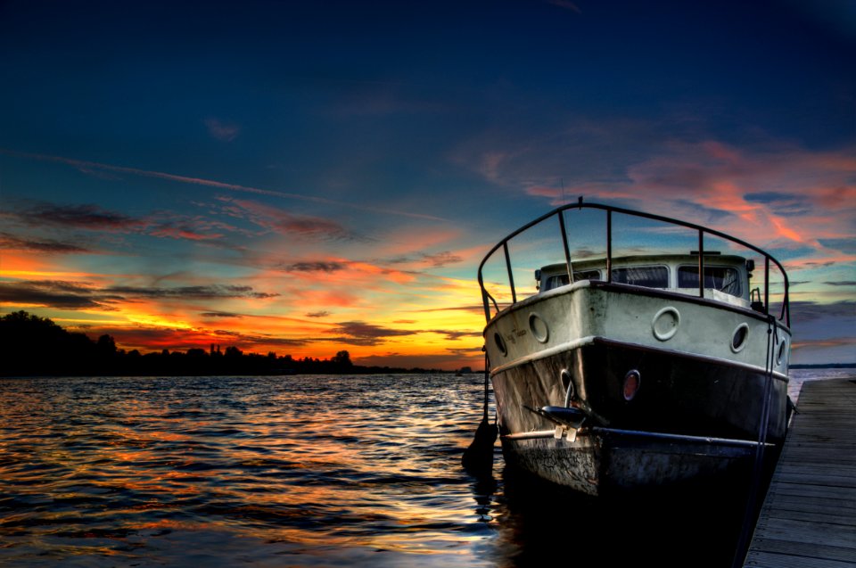 Boat In Water At Sunset