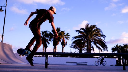 Man Playing Skateboard During Daytime photo