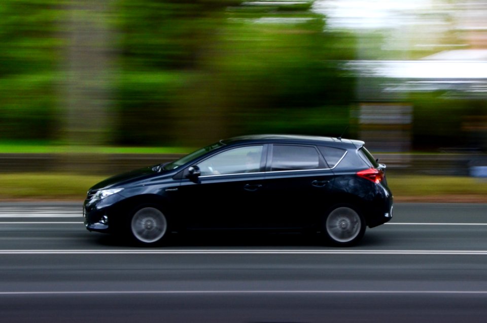 Blur Of Car Driving On Road