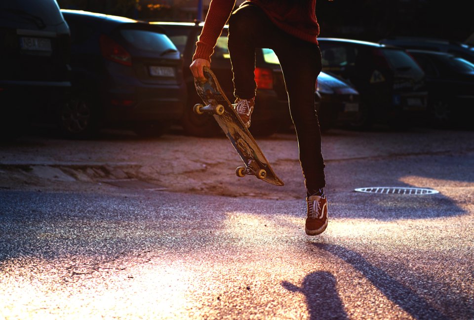 Person In Red Long Sleeved Shirt And Black Skinny Pants Riding A Skateboard