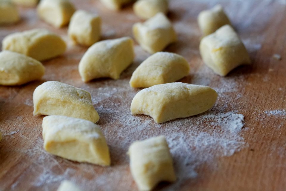 Sliced Dough On Brown Wooden Table