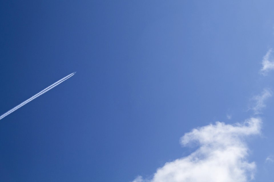 Jet Under Clear Blue Sky During Daytime