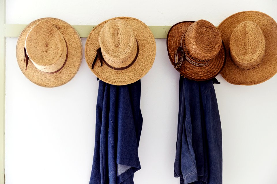 Men's straw hats, hanging inside the farmhouse at Yoder's Amish Home. Original image from Carol M. Highsmith’s America, Library of Congress collection.