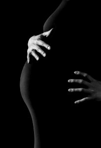 Gray Scale Photo Of A Pregnant Woman photo