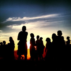 Silhouette Of People At Sunset photo