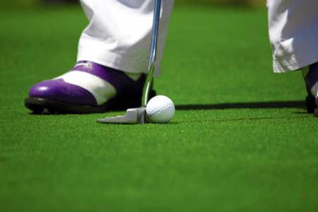 Person In White Pants Playing Golf photo