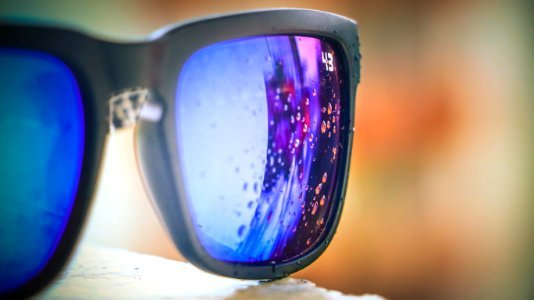 Bubbles Reflected On Lens Of Black Framed Sunglasses photo