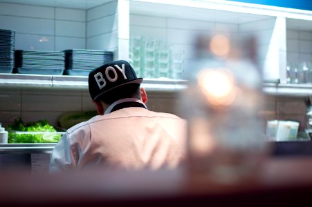 Man In White Button Up Shirt Wearing Boy Printed Black And White Fitted Hat photo