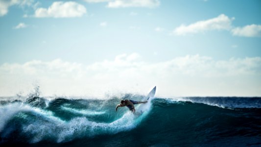 Surfer Catching Wave