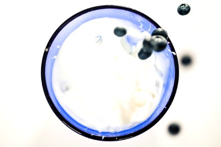 Blueberries Splashing In Milk