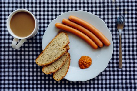 Sausages Bread And Coffee On Table photo