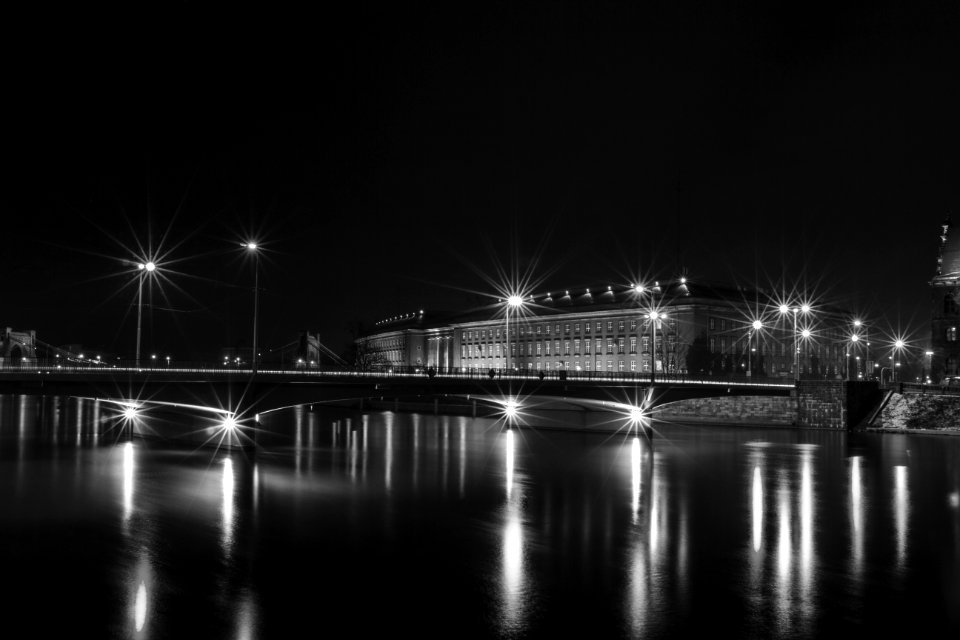 White Building Near Bridge With Lights