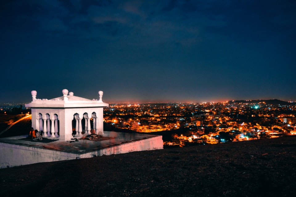 White House On The Roof Deck With City Skyline View During Night Time