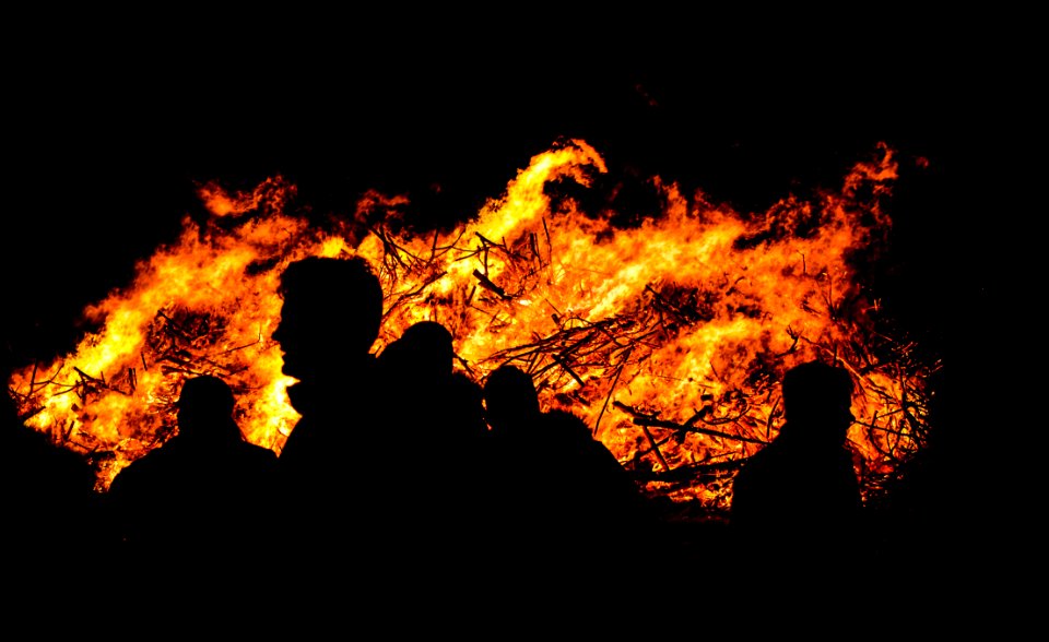 Silhouette Of People By Bonfire