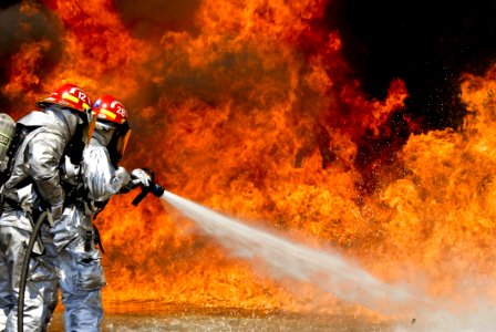 Photo Of A 2 Fireman Killing A Huge Fire photo