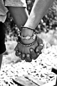 Greyscale Photography Of Two Person Holding Hands