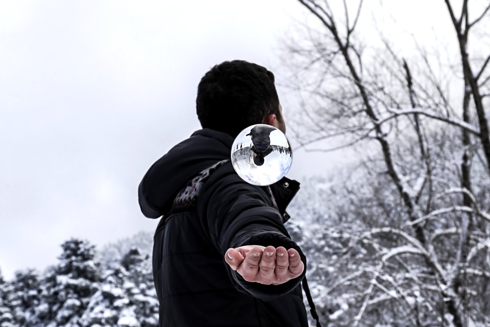 Man In Black Hoodie During Snow Weather At Daytime photo