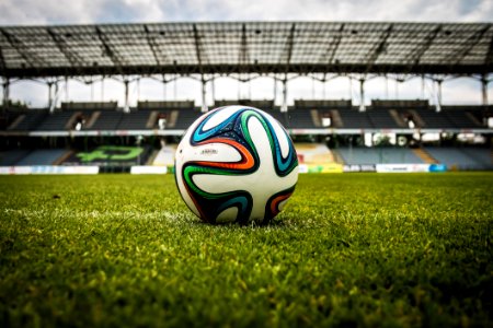 White Black And Green Soccer Ball On Soccer Field photo