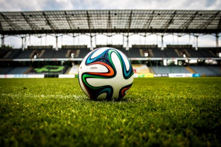 White Black And Green Soccer Ball On Soccer Field