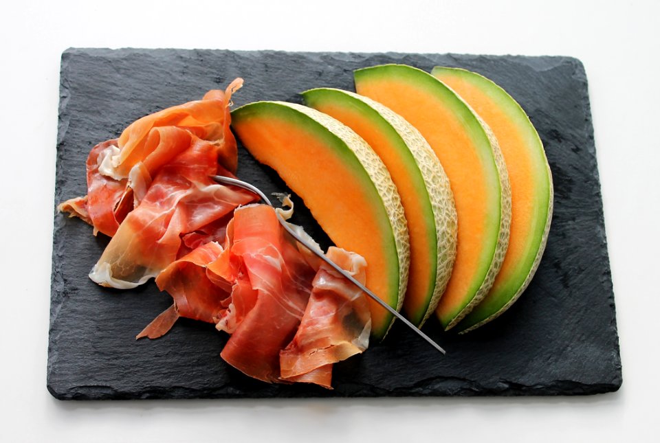 Melon On Black Tray