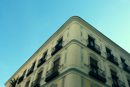 Apartment Building Against Blue Skies photo