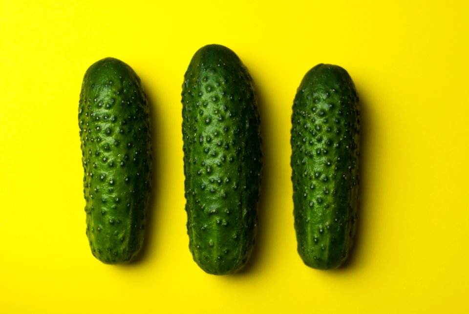 Green Cucumbers On Yellow