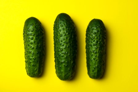 Green Cucumbers On Yellow