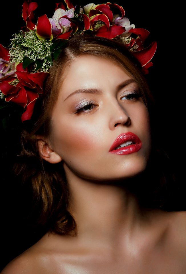 Woman Wearing Red Floral Headdress