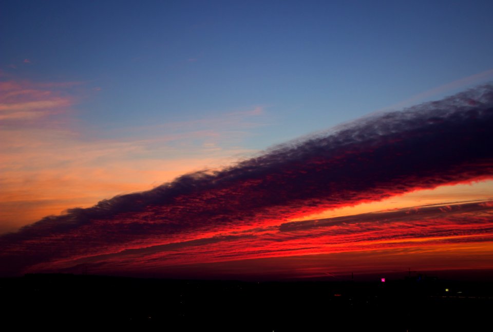 Sunset In Cloudy Skies