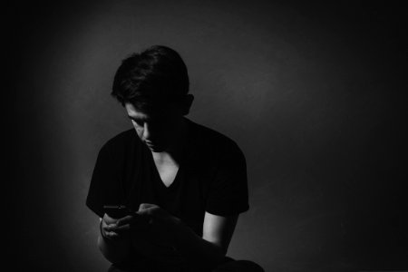 Man Texting In Black And White photo