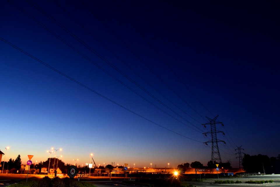 Power Lines On Night Roadside