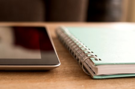 Notebook And Tablet On Desktop photo