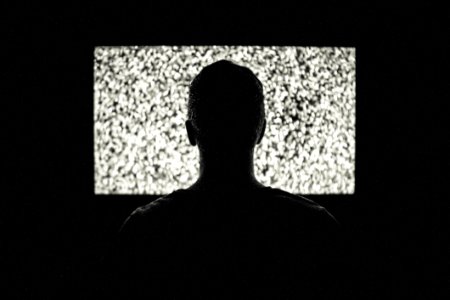 Spectator Looking At Noisy Screen