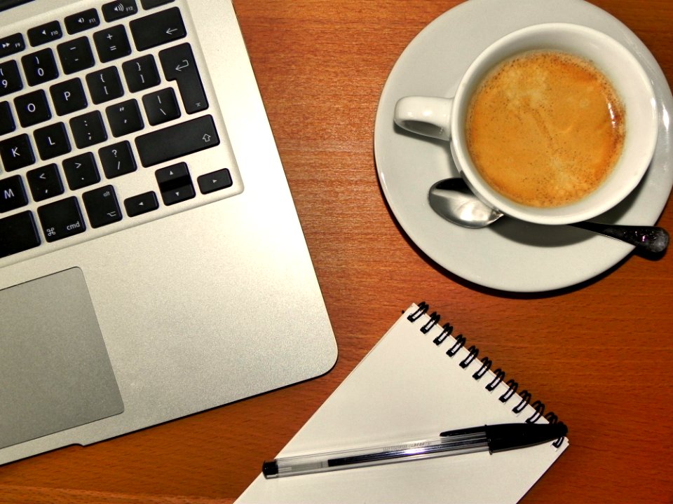 White Ceramic Mug Near On Ball Pen