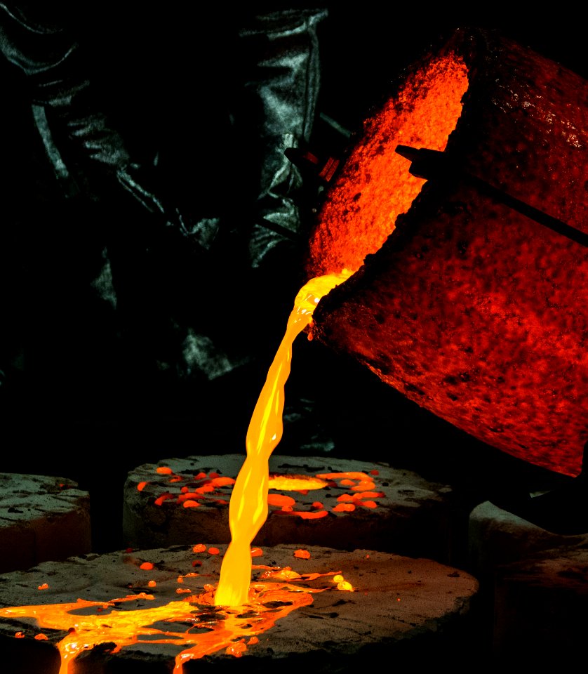 Yellow Container Pouring Yellow Liquid On Brown Wooden Round Textile