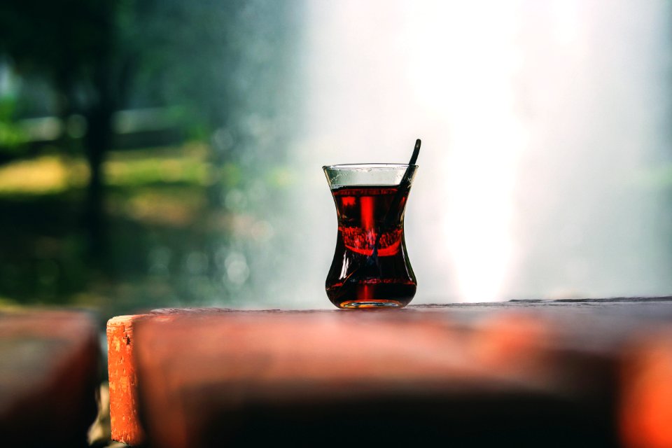 Clear Turkey Tea Glass With Tea On Brown Wooden Table