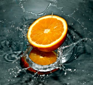 Time Lapse Photography Of Orange Fruit On Water photo
