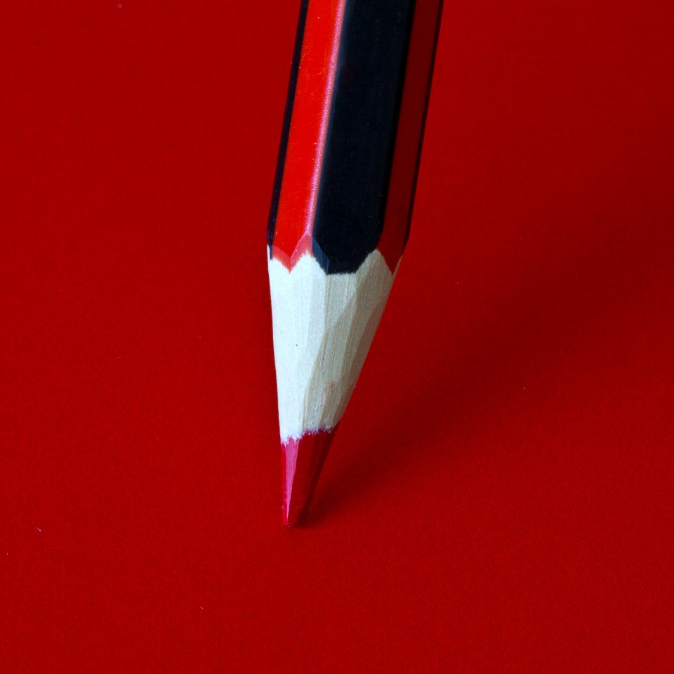 Red Pencil On A Red Surface