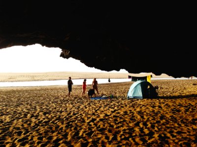 People On Beach By Blue Tent photo